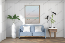 Load image into Gallery viewer, Modern living room with a blue sofa, framed artwork, and decorative items.