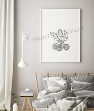 Load image into Gallery viewer, Framed artwork of a baby carriage on a wall above a bed with striped bedding.