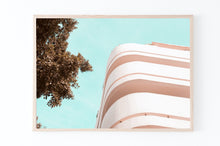 Load image into Gallery viewer, תמונה לקיר של בניין באוהאוס על רקע טורקיז בתל אביב, פרינט להורדה